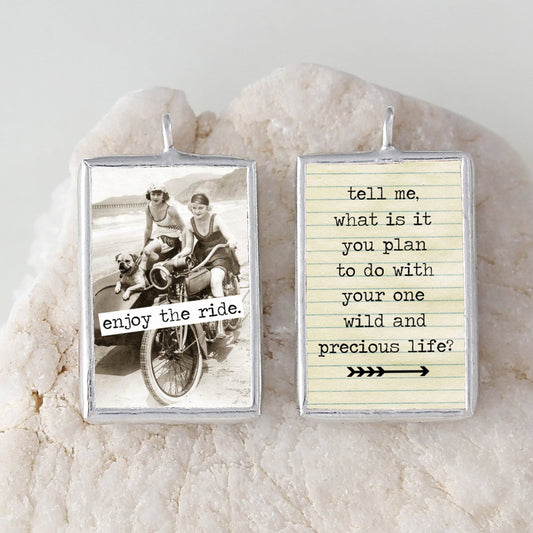 two sided soldered art charm that says enjoy the ride and has a vintage photo of women on motorcycles