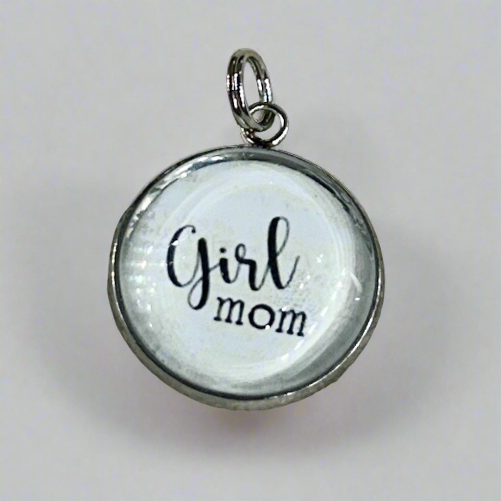 round silver jewelry charm that says Girl Mom